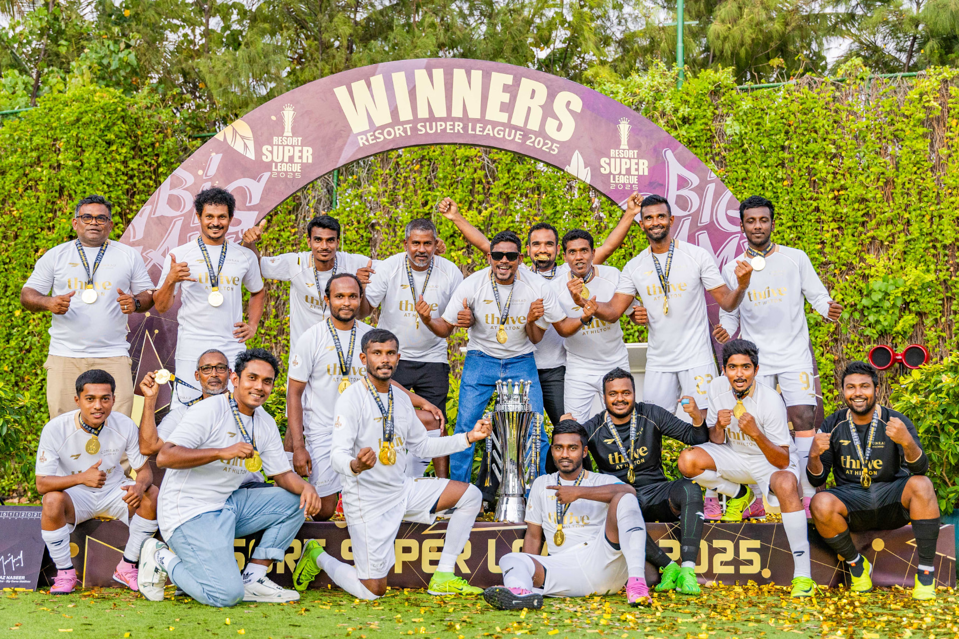 Resort Super League 2025 winners on the podium with the trophy
